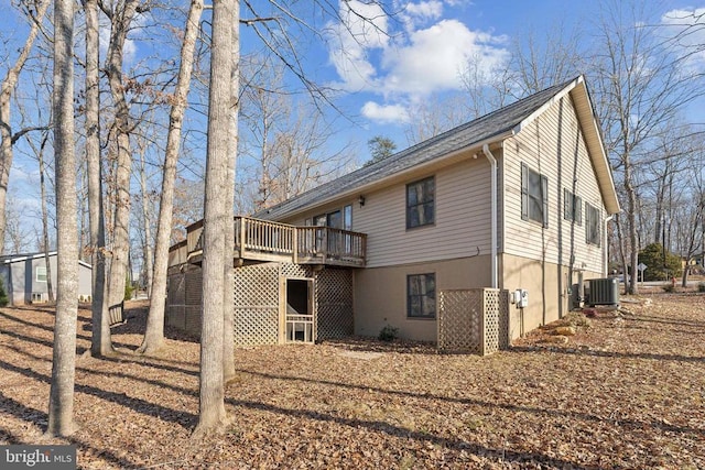 exterior space featuring cooling unit and a wooden deck