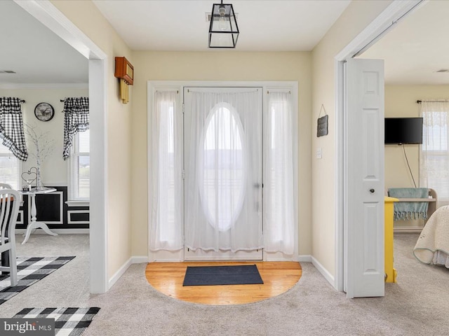 view of carpeted foyer