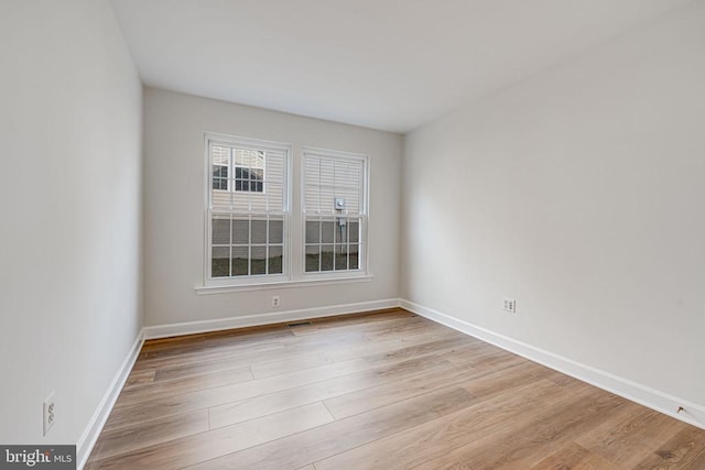 unfurnished room featuring light hardwood / wood-style flooring