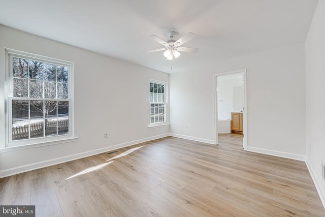 empty room featuring light hardwood / wood-style floors and ceiling fan