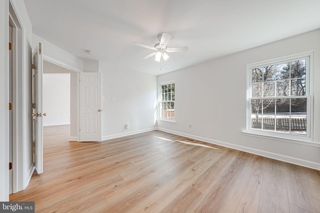 unfurnished bedroom with ceiling fan and light hardwood / wood-style floors