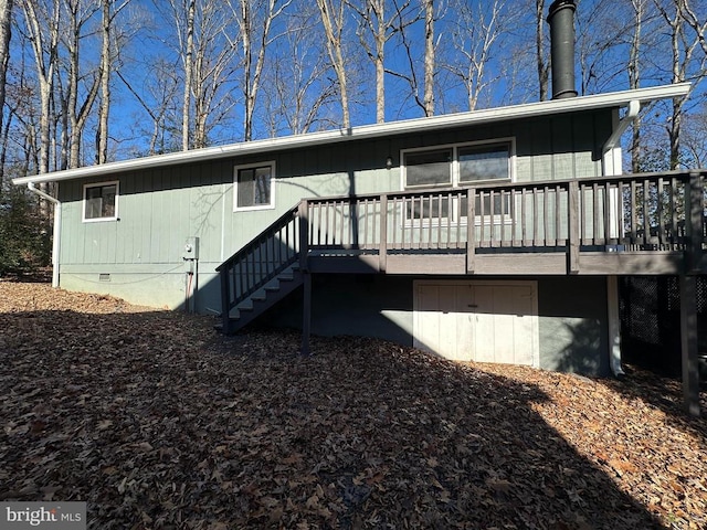 back of house featuring a wooden deck