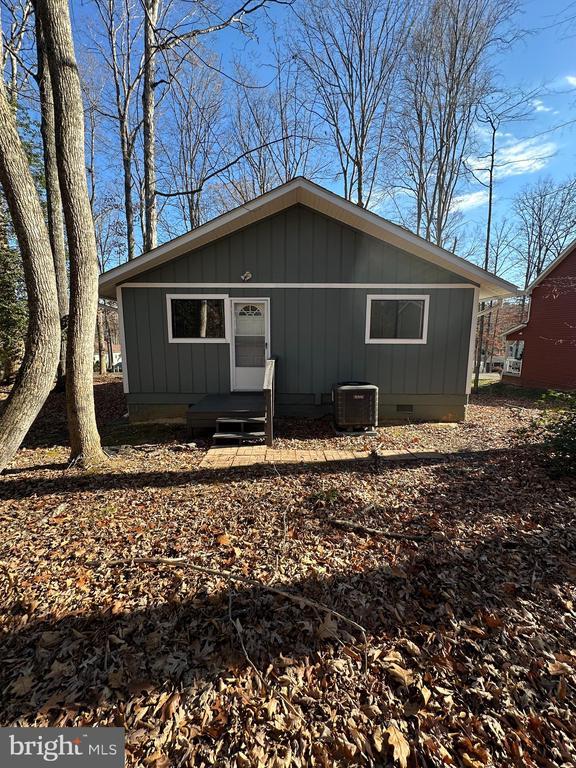 view of front of property featuring cooling unit