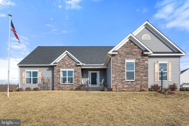 craftsman-style house featuring a front yard