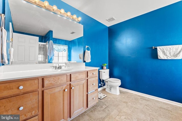 bathroom with vanity and toilet