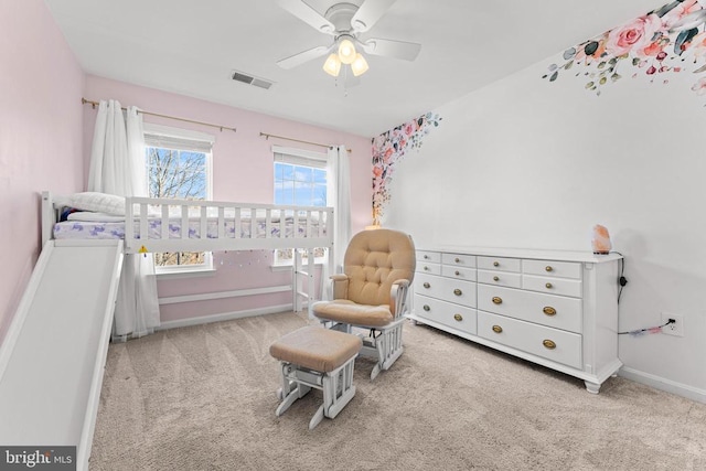 carpeted bedroom with ceiling fan