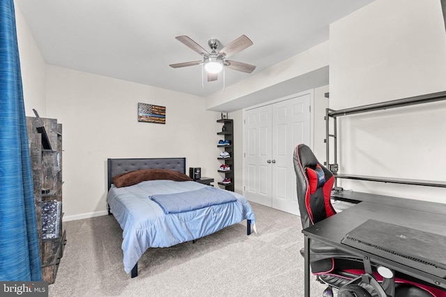 bedroom featuring ceiling fan, carpet floors, and a closet