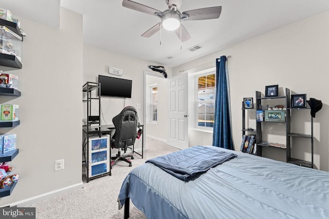 bedroom featuring ceiling fan and light colored carpet