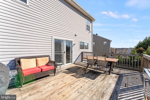 wooden deck featuring an outdoor hangout area