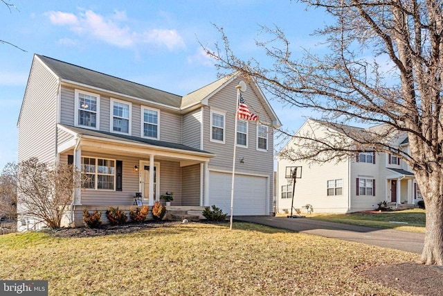 view of front of house with a garage, a porch, and a front lawn