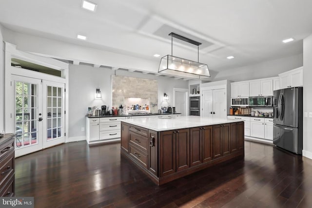 kitchen with dark brown cabinetry, stainless steel appliances, french doors, white cabinetry, and backsplash