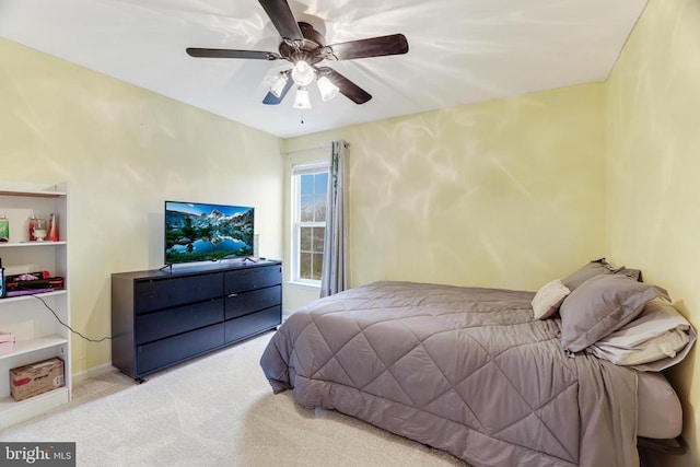 bedroom featuring carpet floors, ceiling fan, and baseboards