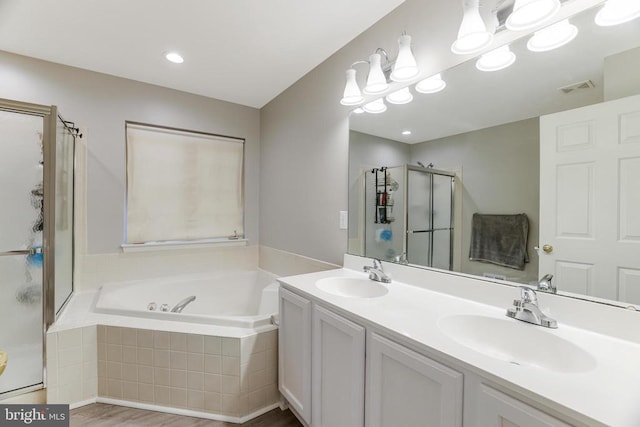 full bath featuring visible vents, a sink, a shower stall, and a bath