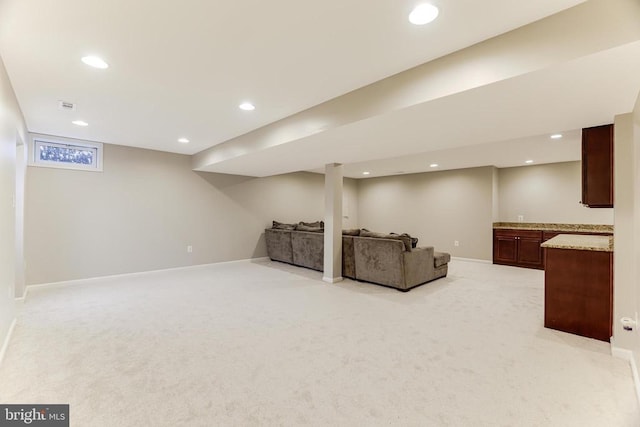 interior space featuring baseboards, recessed lighting, and light colored carpet