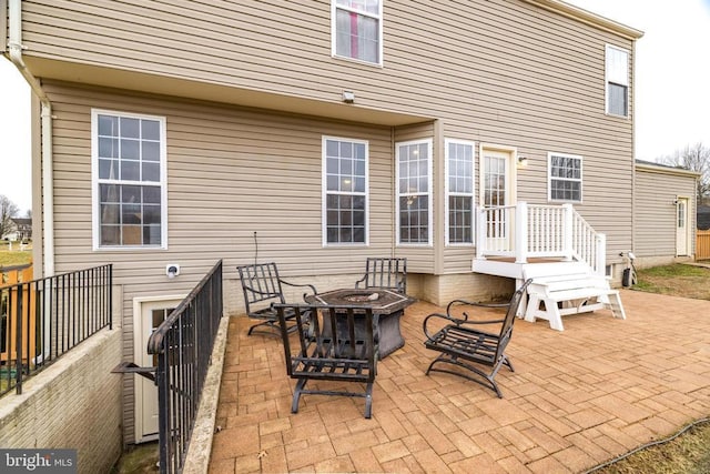 view of patio with an outdoor fire pit