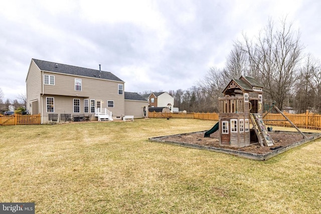 view of jungle gym featuring a fenced backyard and a lawn