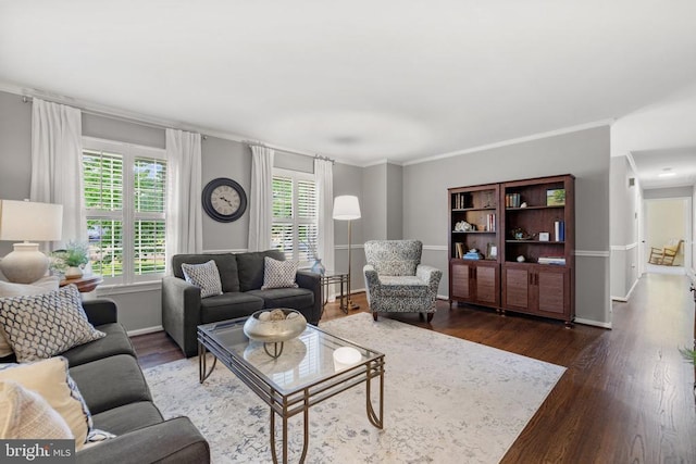 living room with crown molding, dark wood-type flooring, and baseboards