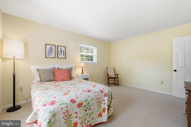 carpeted bedroom with baseboards