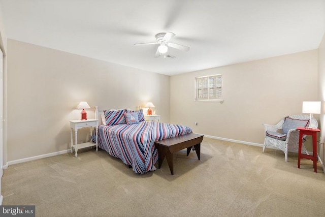 carpeted bedroom with baseboards and a ceiling fan