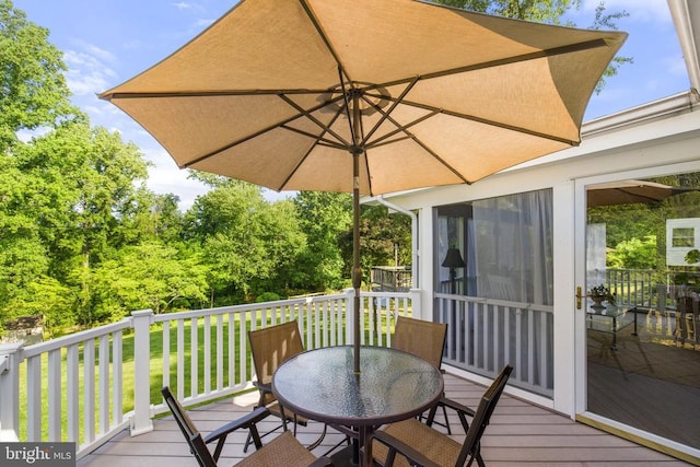 wooden deck with outdoor dining space