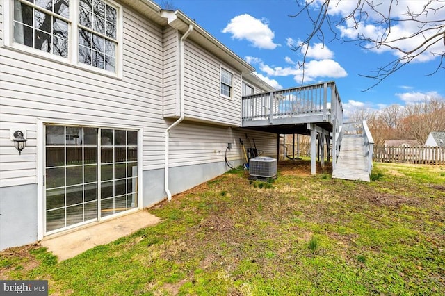 back of house featuring cooling unit, a wooden deck, and stairway