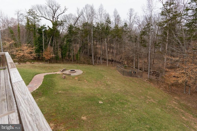 view of yard featuring an outdoor fire pit and a vegetable garden