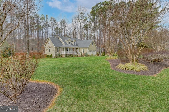 view of front of house featuring covered porch and a front yard