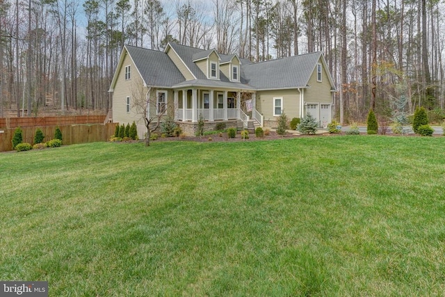new england style home featuring a porch, a front lawn, and fence