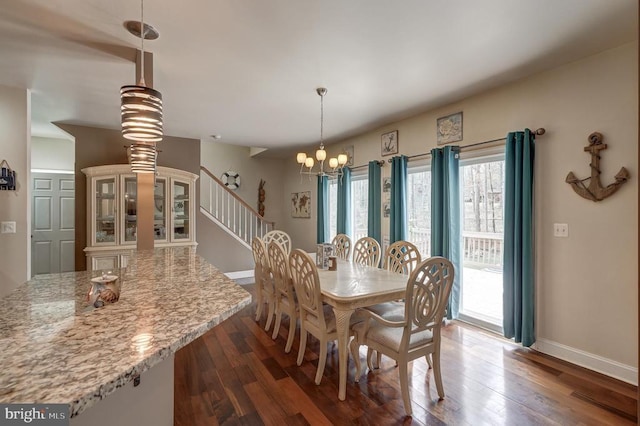 dining space with stairway, baseboards, a chandelier, and dark wood finished floors