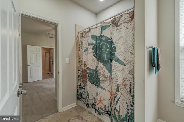 bathroom featuring baseboards