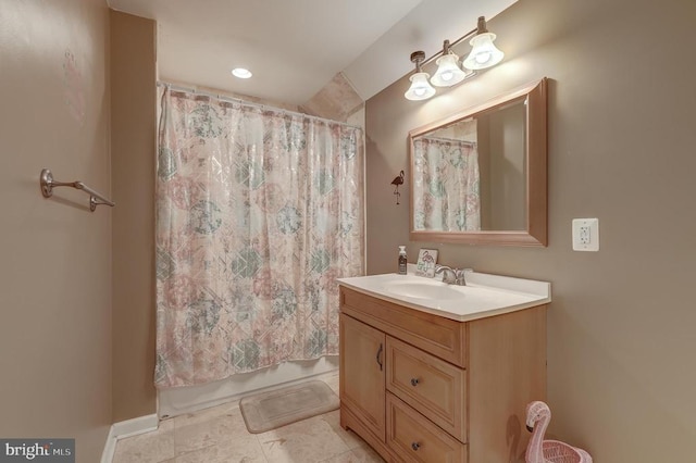 bathroom featuring vanity and shower / tub combo