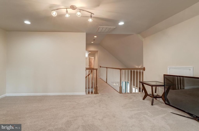 living area with recessed lighting, carpet, visible vents, and baseboards