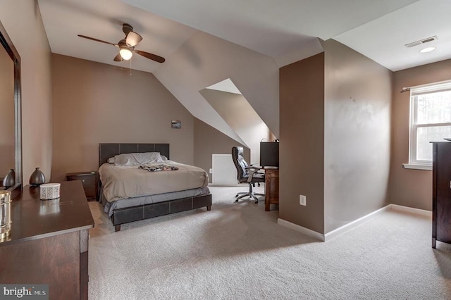 bedroom featuring visible vents, carpet flooring, baseboards, and vaulted ceiling
