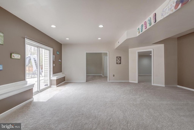 interior space featuring recessed lighting, baseboards, and carpet floors