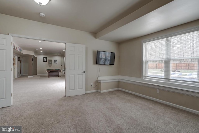 spare room featuring light carpet, recessed lighting, billiards, and baseboards