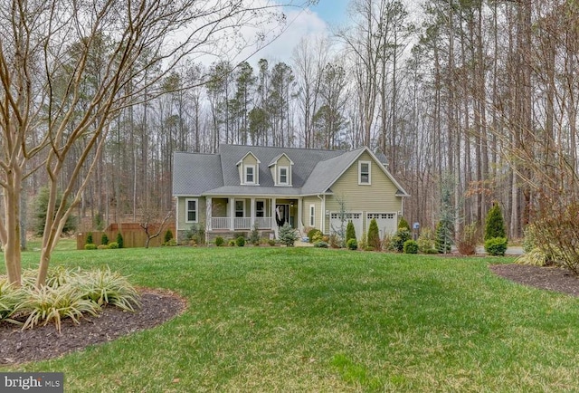 cape cod house with a front yard and covered porch