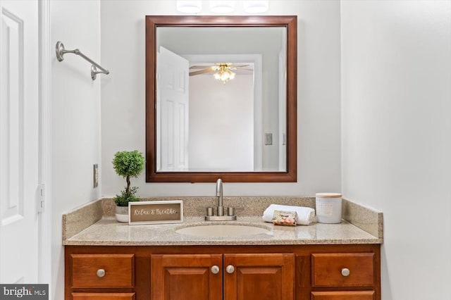 bathroom with a ceiling fan and vanity