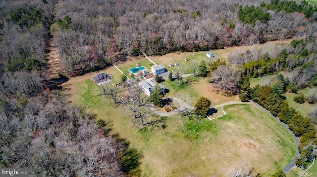 bird's eye view featuring a forest view