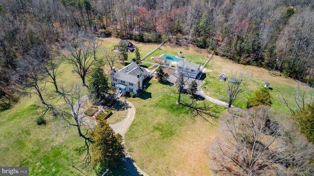 drone / aerial view with a view of trees