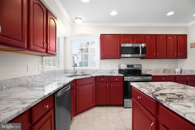 kitchen with light stone counters, stainless steel appliances, marble finish floor, a sink, and crown molding