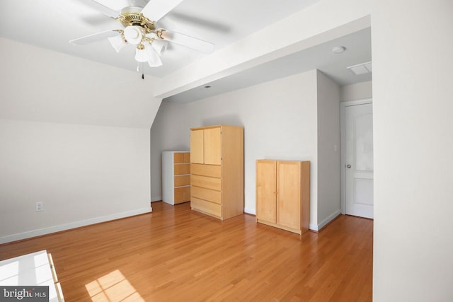 bonus room with baseboards, a ceiling fan, light wood finished floors, and vaulted ceiling