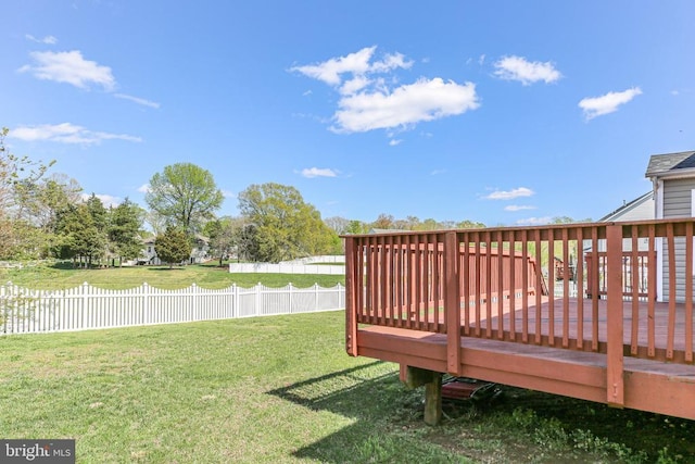 view of yard featuring a deck and fence