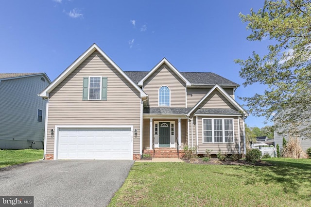 traditional home with a front yard, driveway, a garage, and a shingled roof
