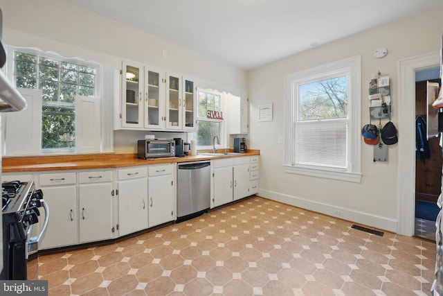 535 Winchester St, Warrenton, VA 20186 - kitchen with a sink, visible vents, white cabinetry, range with gas stovetop, and dishwasher
