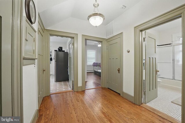 535 Winchester St, Warrenton, VA 20186 - hall with vaulted ceiling, light wood finished floors, and baseboards