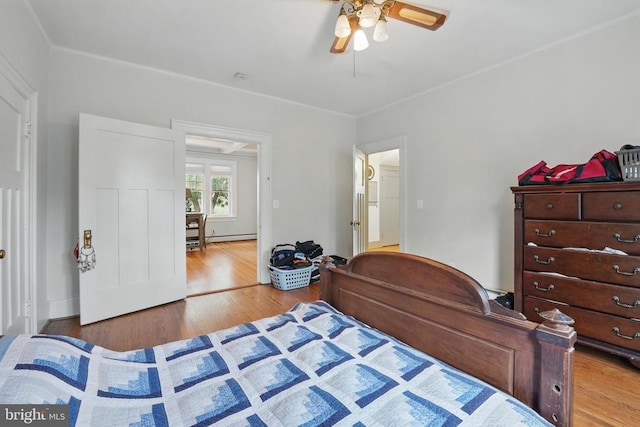 535 Winchester St, Warrenton, VA 20186 - bedroom featuring a baseboard radiator, wood finished floors, and a ceiling fan