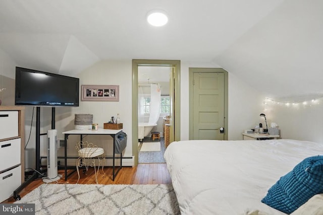 535 Winchester St, Warrenton, VA 20186 - bedroom with vaulted ceiling, baseboard heating, and wood finished floors
