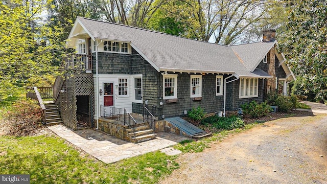 535 Winchester St, Warrenton, VA 20186 - view of front of house with a chimney, stairway, and a shingled roof