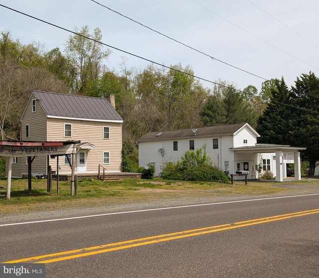 view of front of home featuring a chimney