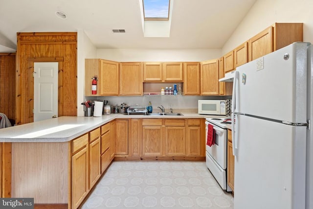 kitchen featuring open shelves, white appliances, a peninsula, under cabinet range hood, and visible vents